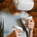 Cooling Innovation - Young male with VR goggles and controllers
