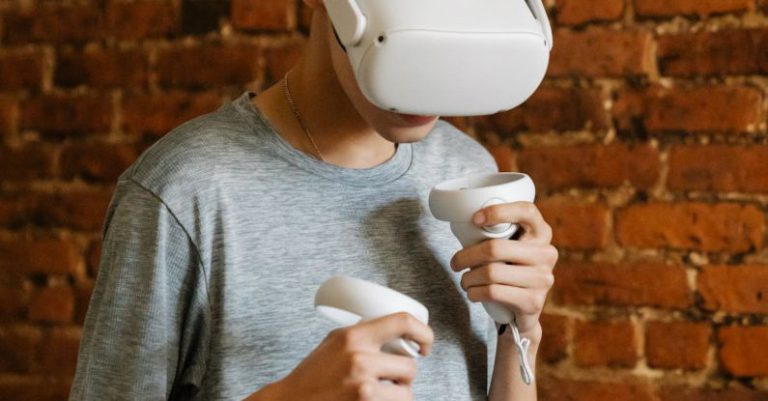 Cooling Innovation - Young male with VR goggles and controllers