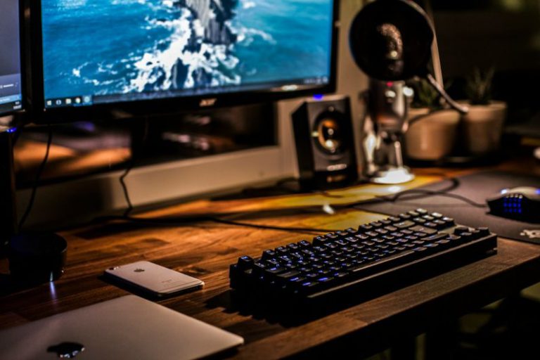 Gaming Cables - black corded gaming computer keyboard and flat screen monitor