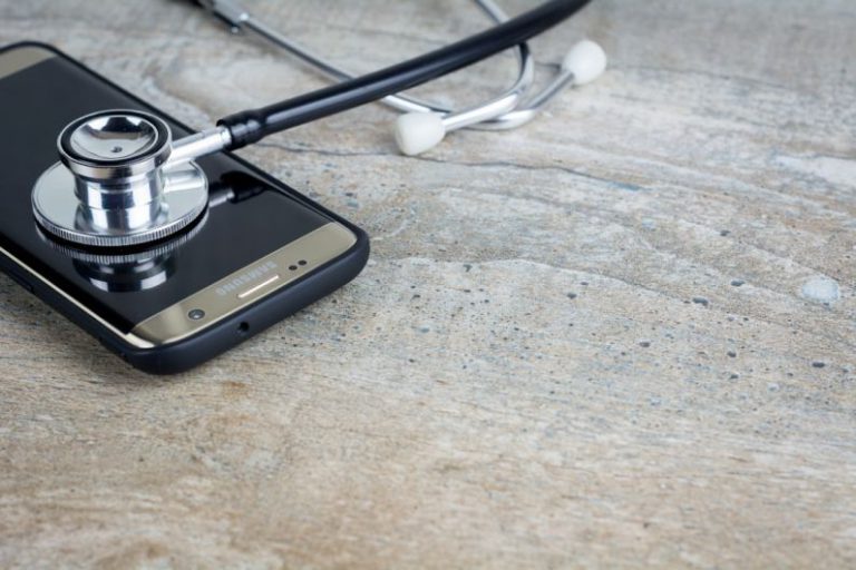 Overclocking Troubleshooting - a phone with a stethoscope on top of it
