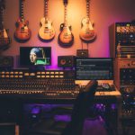 Music Production - person playing brown and white acoustic guitars