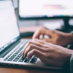 Financial PC - person using MacBook Pro