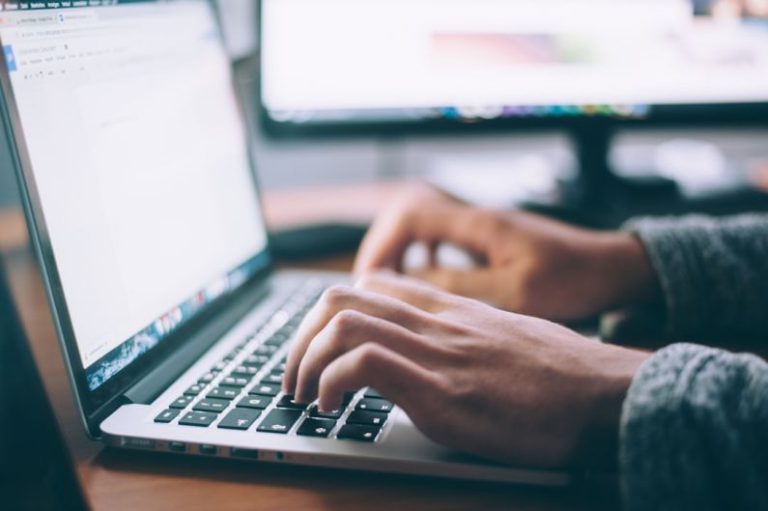 Financial PC - person using MacBook Pro