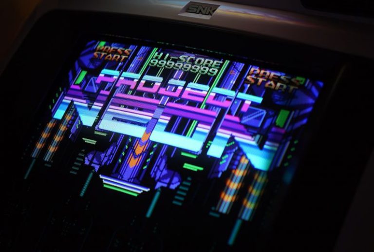 Arcade Cabinet - closeup photo of black and gray digital arcade game machine turned-on