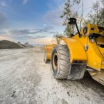 External Hard Drive DIY - a yellow bulldozer is parked on a dirt road