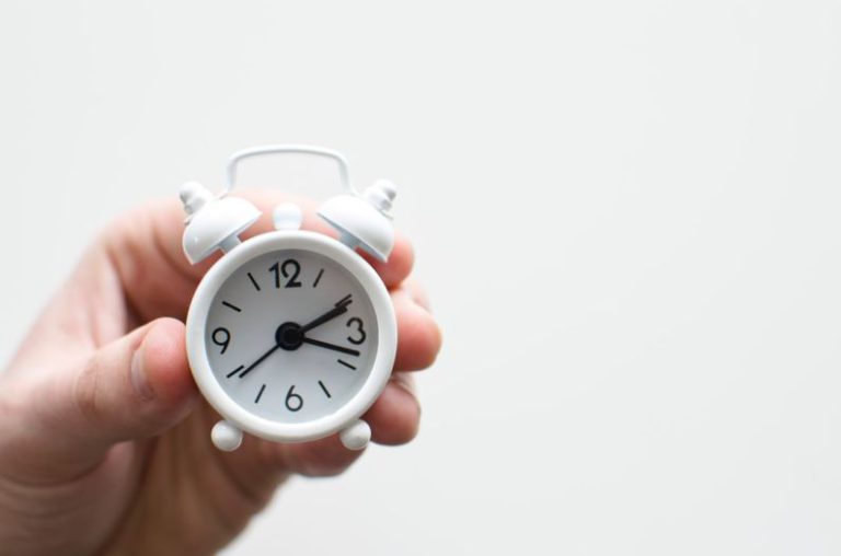 PC Build Time - person holding white mini bell alarmclock