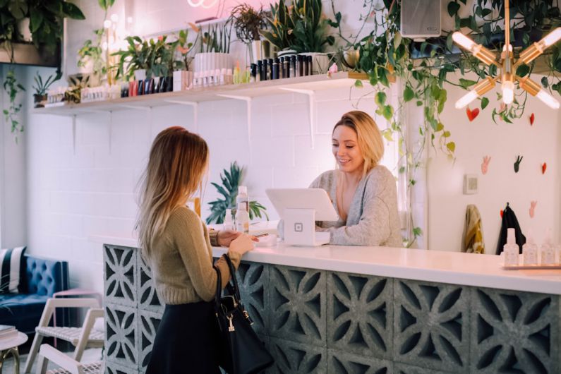 Build Vs Buy - woman facing on white counter