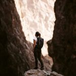 VR Ready Check - a person standing on a rock in a canyon