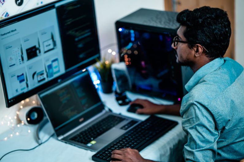 Low Budget Gaming PC - man in blue dress shirt using computer