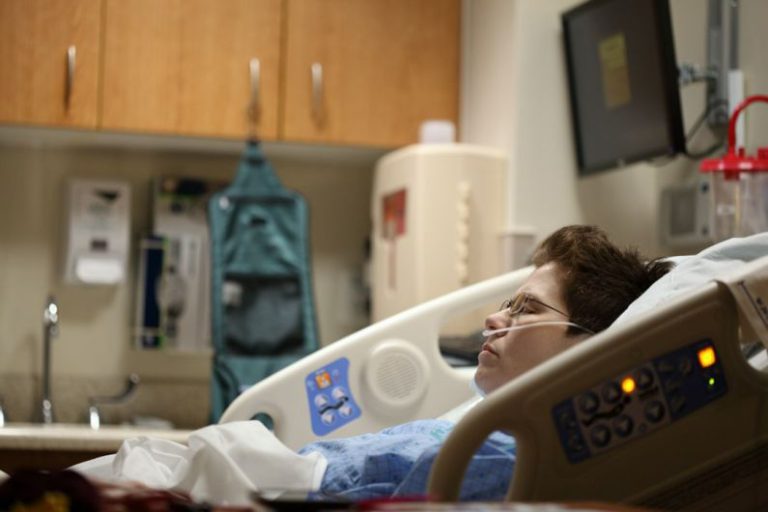 Cooling Case Choice - boy lying on beige recliner hospital bed