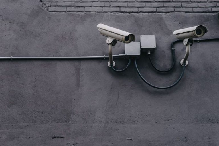 Overclocking Security - two bullet surveillance cameras attached on wall
