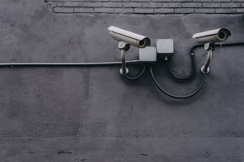 Overclocking Security - two bullet surveillance cameras attached on wall