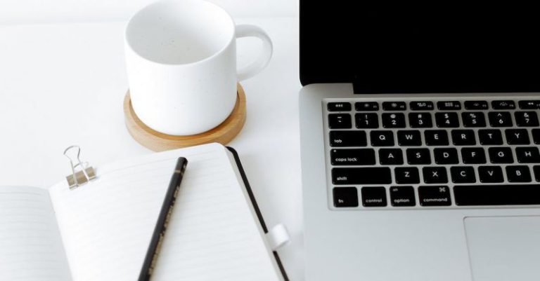 Desktop Assembly - Workplace with laptop and opened diary