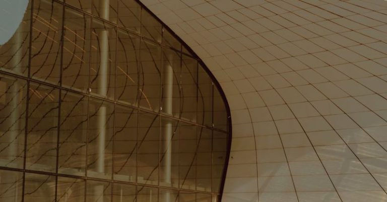 Windows Optimization - A modern building with curved walls and a curved roof