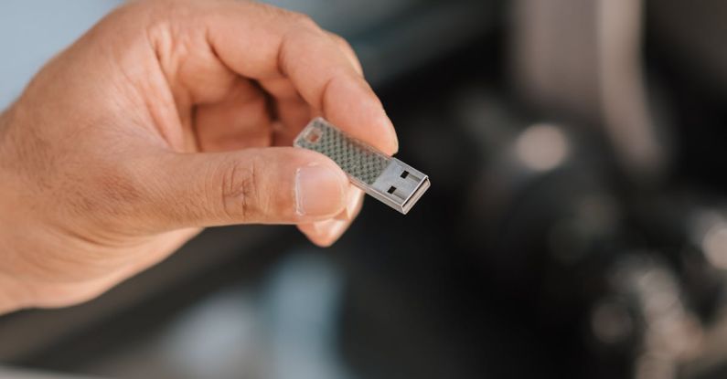Software Tools - Man using flash drive storing files and information