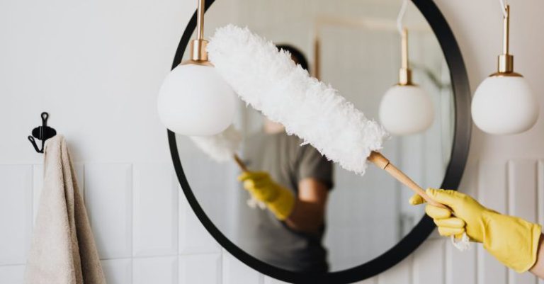 Cleaner Tools - Crop woman dusting lamp during housework