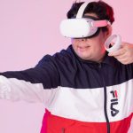 VR Ready - Man in a Jacket Wearing a VR Headset and Holding the Controllers