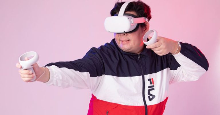 VR Ready - Man in a Jacket Wearing a VR Headset and Holding the Controllers