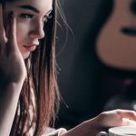 Streaming PC - Photo of Woman Lying on Bed While Using Laptop