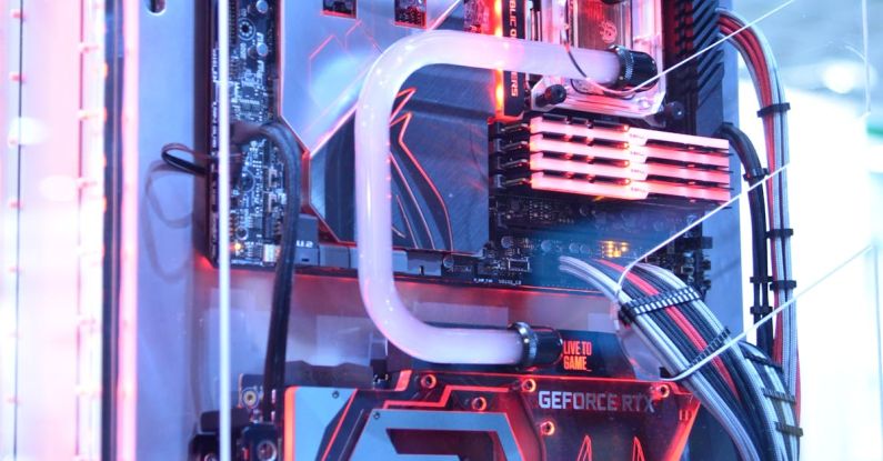 Water Cooling - Black and Red Computer Motherboard