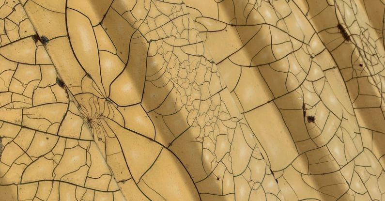 Acrylic Panel - From above of geometric yellow surface with symmetric patterns and cracks as abstract background