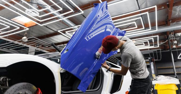 Vinyl Wrap - A Man Putting on a Blue Sticker on the Car Door