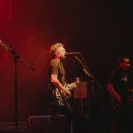 Performance Budget - A band playing on stage with red lights