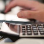 Esports Budget - Person Using Calculator