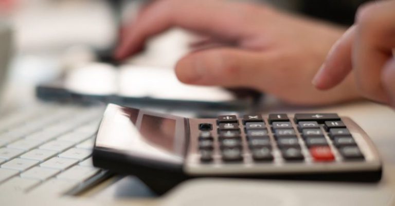 Esports Budget - Person Using Calculator