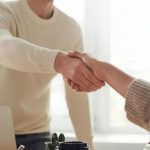 Negotiating Deals - Man and Woman Near Table