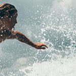 Overclocking Extreme - Man Riding White Surfboard