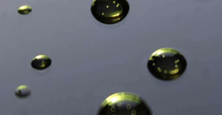Air Vs Liquid - Abstract background with green water drops
