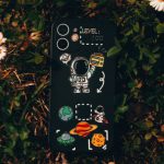 Case Fans Airflow - Phone with Creative Case on Grass with Flowers