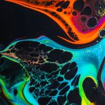 Liquid Cooling Beginner - Colorful mix of neon paints swirling on black surface